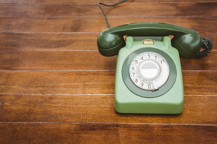 View of an old phone on wood desk
