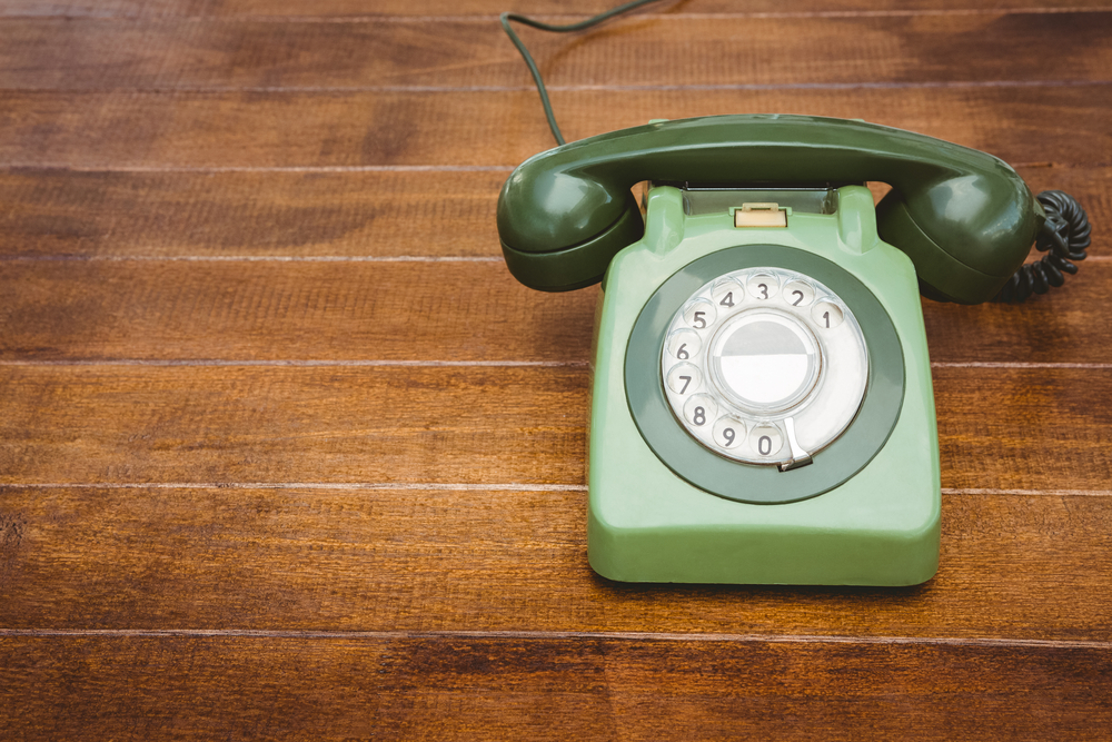 View of an old phone on wood desk-2